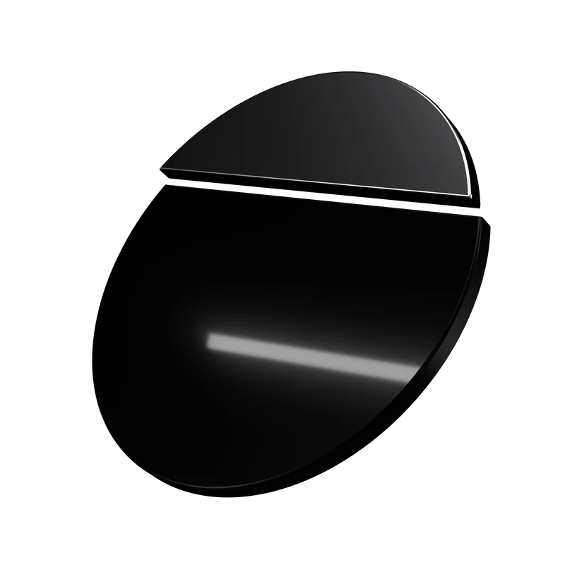 The Aperture object in low light: a single line of studio light across the black ceramic.